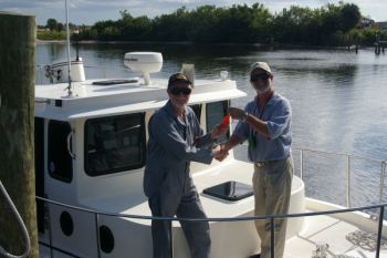 A happy owner 'cuz he knows how to change his fuel filters! Nordic Tug 32 + 2, Learn to Do It Yourself