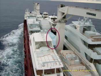 The Krogen Express at sea...on a ship from Asia heading to Port Everglades in Fort Lauderdale. You can see her just inside the circled area under a blue and white stripe tarp. Krogen Express 52 Offload from Asia