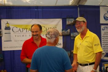 Captain Chris visits with boaters at our booth. Stepping in for Claiborne Young