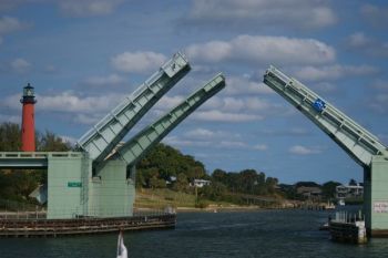 Jupiter Federal Bride actually has two spans to open for any vessel greater then 23 feet in height. Jupiter FL. Bridges? How do I navigate under drawbridges or get the drawbridge to open?