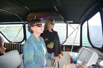 Nancy at the helm. DeFever 47 - Communications are Key in Trawler Training