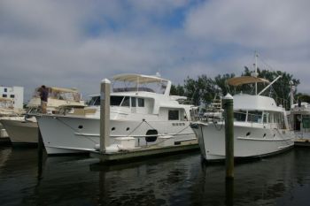 Here are two different size cruising boats, both stern facing the dock. Notice the full length floating finger pier alongside each boat. Docking Like A Pro