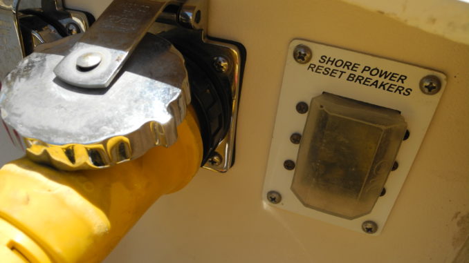3 Shorepower connections should have a major circuit breaker, sometimes below deck. This one is in a rubber waterproof cover next to the power cord connection